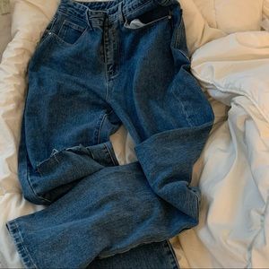 Y2K ripped denim jeans with rips on both sides